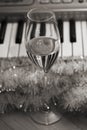 Reflection of piano keys in wine glass, pianoforte