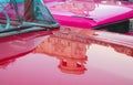 Reflection on 1953 Pink Dodge Desoto and 1954 pink Ford Fairlaine in Havana, Cuba