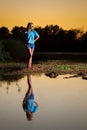 Reflection of a Preteen Girl in a Pool of Water She is Looking Royalty Free Stock Photo