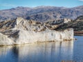 Reflection of qurtz sandstone formations in the waters of the Blue Lake at St Bathans in New Zealand