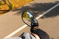 Reflection in the rearview mirror of two-way asphalt bike path in the urban park in perspective Royalty Free Stock Photo