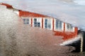 Reflection of a red house in the water Royalty Free Stock Photo