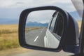 Reflection of the road at the car side mirrow. Royalty Free Stock Photo