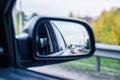 The reflection of the road with cars in the rearview mirror car traffic in the evening Royalty Free Stock Photo