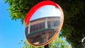 A reflection round mirror on the street in Penang