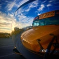 Reflection of school bus in convex mirror