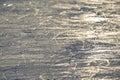 Reflection of the setting sun on the surface of the ice rink. Texture and backgrounds Royalty Free Stock Photo