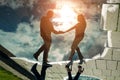 Reflection shadow of a young couple walking in the rain in the city pedestrian zone Royalty Free Stock Photo