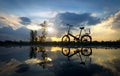 Reflection of Silhouette bicycle park on the waterfront Royalty Free Stock Photo