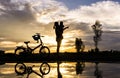 Reflection Silhouette of mother with her toddler against the sun