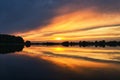 reflection of the sky in the water. gold, yellow and pink colors of the sky are reflected in the lake Royalty Free Stock Photo