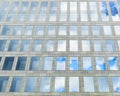 Reflection of the sky in the windows of the modern retail and office building Four Winds on 1st Tverskaya-Yamskaya Street