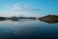 A reflection of snow capped Mount Shasta in a clear water in lake  at sunrise in California State, USA.  Mount Shasta is a volcano Royalty Free Stock Photo