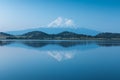 A reflection of snow capped Mount Shasta in a clear water in lake  at sunrise in California State, USA.  Mount Shasta is a volcano Royalty Free Stock Photo