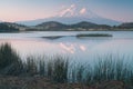 A reflection of snow capped Mount Shasta in a clear water in lake  at sunrise in California State, USA.  Mount Shasta is a volcano Royalty Free Stock Photo