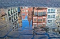 Reflection of some historic building of Frankfurt`s old city in a puddle of water Royalty Free Stock Photo