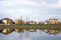 Reflection of a spring or autumn landscape in a city lake Royalty Free Stock Photo