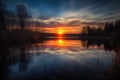 reflection of the sun rising over lake, with colors of dawn and sunrise Royalty Free Stock Photo