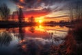 reflection of the sun rising over lake, with colors of dawn and sunrise Royalty Free Stock Photo