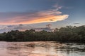 Reflection of a sunset by a lagoon inside the Amazon Rainforest Basin. Royalty Free Stock Photo
