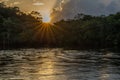 Reflection of a sunset by a lagoon inside the Amazon Rainforest Basin Royalty Free Stock Photo