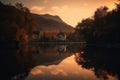 reflection of sunset on the lake and chapel in mountains, with silhouette of trees Royalty Free Stock Photo