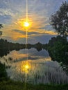The reflection of the sunset in lake glass Royalty Free Stock Photo
