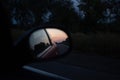 Reflection of sunset in the side mirror of the car Royalty Free Stock Photo