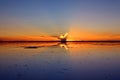 Reflection of the Sunset Sky on the Flooding Salt Flats, the Iconic Mirror Effect at Salar de Uyuni in Bolivia Royalty Free Stock Photo