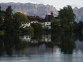 Reflection of swiss town Buchs in Werdenbergersee in St. Gallen Switzerland Royalty Free Stock Photo