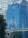 Reflection of Thailand late King Bhumiphol in building glass