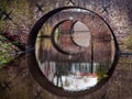 Reflection of three bridges in water of a canal