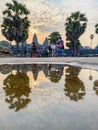 Reflection of tourists at sunrise in Angkor Wat Royalty Free Stock Photo