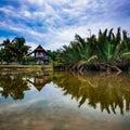 Reflection of traditional Malay house in the river in Terengganu Malaysia Royalty Free Stock Photo