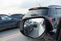 Reflection of traffic flow in left side rear view mirror at rush hour Royalty Free Stock Photo