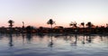 Reflection of trees and bildings in the water surface. Royalty Free Stock Photo