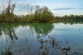 reflection of trees in water, photo as a background , autumn colors in north italy Royalty Free Stock Photo