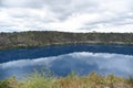 The reflection from water lake with bushland at Blue Lake is a large, monomictic, crater lake located in a dormant volcanic Royalty Free Stock Photo