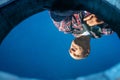 Reflection in the water of the sky and a portrait of a bald man Royalty Free Stock Photo