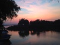 Reflection in the water, sunset over Mekong river. Blue and pink sky. Royalty Free Stock Photo