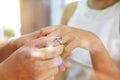 Reflection from window glass of Bride and groom with wedding rings Royalty Free Stock Photo