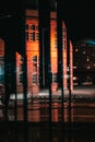 Reflection in the windows of an old building in Cardiff Bay at night Royalty Free Stock Photo