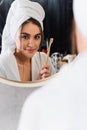 reflection of woman in bathrobe with