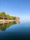 Reflection of a wooden house on the lake, house on the river Royalty Free Stock Photo