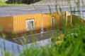 The reflection of a yellow house in the water's mirror surrounded by greenery Royalty Free Stock Photo