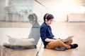 Young Asian business man listening to music while using laptop Royalty Free Stock Photo