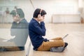 Young Asian business man listening to music while using laptop Royalty Free Stock Photo