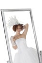 Reflection of young bride in mirror over white background Royalty Free Stock Photo