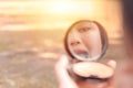 Reflection of a young lady putting on her make up Royalty Free Stock Photo