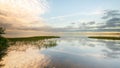 Reflections on a becalmed Lough Neagh